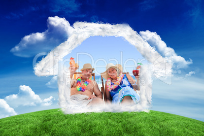 Composite image of mature couple sitting on deck chairs