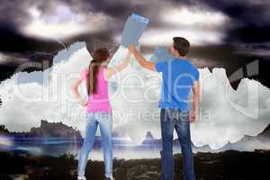 Composite image of couple painting together