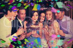 Composite image of attractive friends celebrating a birthday