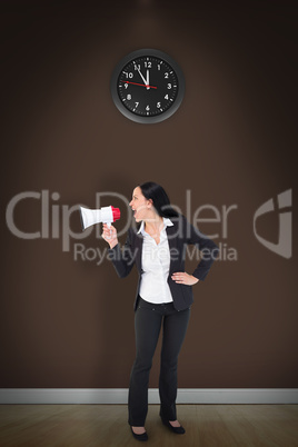 Composite image of pretty businesswoman shouting with megaphone