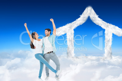 Composite image of happy casual couple cheering together