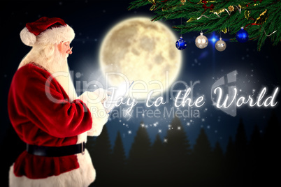 Composite image of santa uses a tablet pc