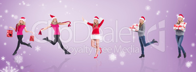 Composite image of festive blonde carrying gift bags
