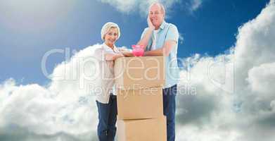 Composite image of older couple smiling at camera with moving bo