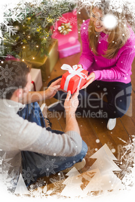 Composite image of sitting couple giving each other presents