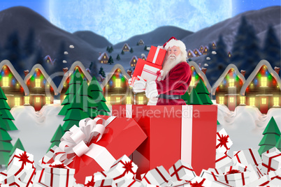 Composite image of santa standing in large gift