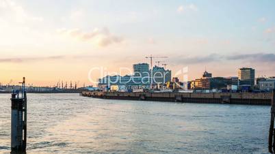 Hamburg Hafencity with harbor, Elbe river, clouds and sunbeams in the evening - DSLR hyperlapse / tracking shot / timelapse