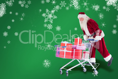 Composite image of santa rides on a shopping cart