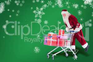 Composite image of santa rides on a shopping cart