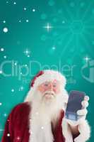 Composite image of santa claus shows a smartphone