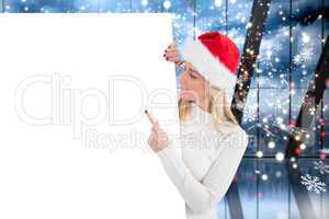 Composite image of festive blonde showing poster