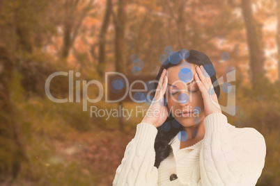 Composite image of woman suffering from a migraine