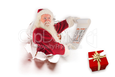 Composite image of father christmas holds a list