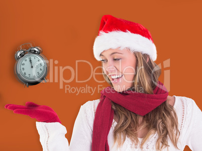 Composite image of festive blonde presenting with hand