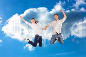 Composite image of couple jumping and holding hands