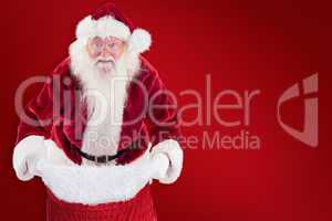 Composite image of santa open his red bag