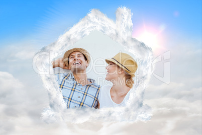 Composite image of young hip couple laughing on bench