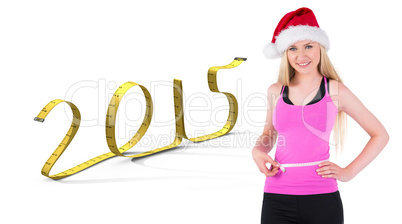 Composite image of fit festive young blonde measuring her waist