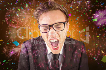 Composite image of young angry businessman shouting at camera