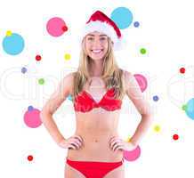 Composite image of festive fit blonde in red bikini