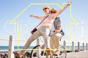 Composite image of happy casual couple going for a bike ride on