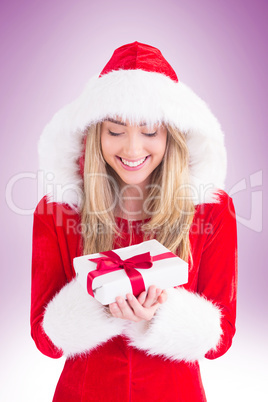 Sexy santa girl holding gift