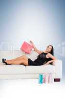 Woman sitting with shopping bags