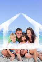 Composite image of portrait of a family at the beach