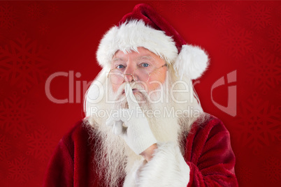 Composite image of santa asking for quiet to camera