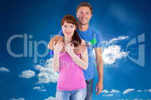 Composite image of couple hugging and holding brush