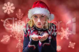 Composite image of festive blonde holding her hands out