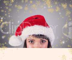 Composite image of close up portrait of pretty woman in santa ha