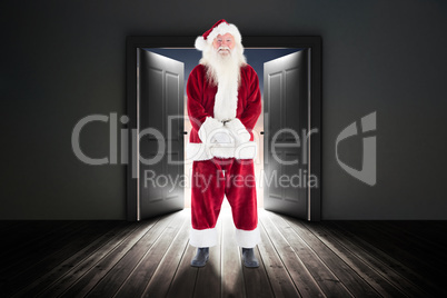 Composite image of jolly santa smiling at camera