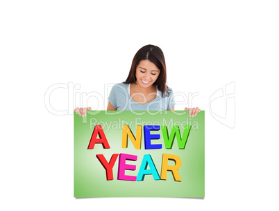 Composite image of gorgeous woman holding a  board