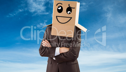 Composite image of anonymous businessman with arms crossed