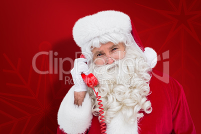 Composite image of santa claus on the phone