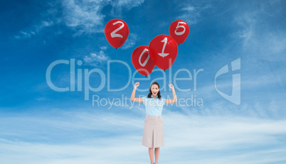 Composite image of victorious stylish businesswoman posing