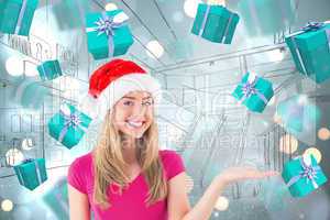 Composite image of festive blonde presenting with hand