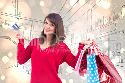 Composite image of brunette holding gift and credit card