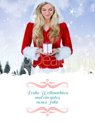 Composite image of pretty girl in santa outfit holding gift