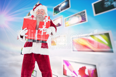 Composite image of santa carries a few presents