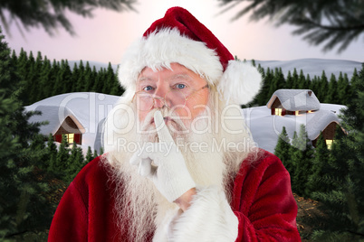 Composite image of santa asking for quiet to camera