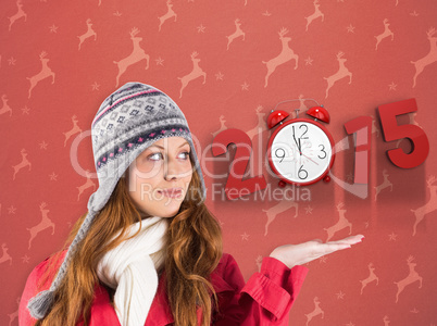 Composite image of pretty redhead in warm clothing