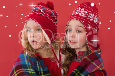 Composite image of festive little girls under a blanket