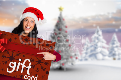 Composite image of woman pointing at white sign