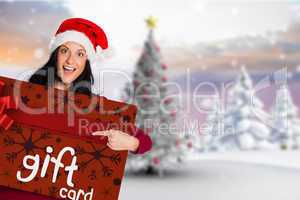 Composite image of woman pointing at white sign