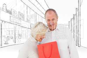Composite image of couple with shopping bag