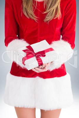 Sexy santa girl holding gift