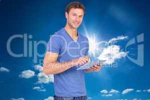 Composite image of man scrolling through tablet pc