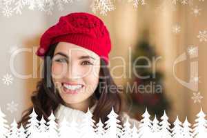 Composite image of portrait of a smiling brunette at christmas